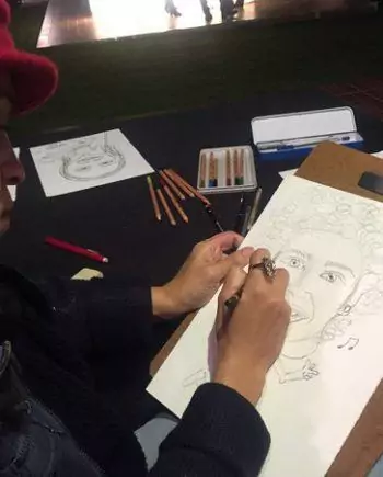 Female caricaturist in Dubai